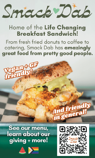 A sandwich is shown on a menu with the words “Smack Dab" written above it. AI generated content