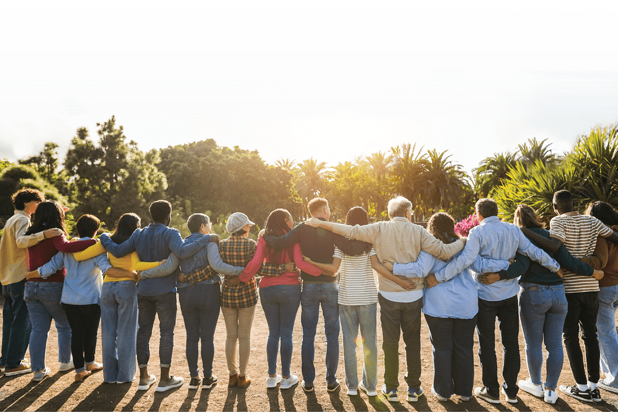 Group of multigenerational people hugging each others - Support, multiracial and diversity concept - Main focus on senior man with white hairs