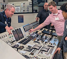 A control panel with many buttons and switches. Description generated by AI