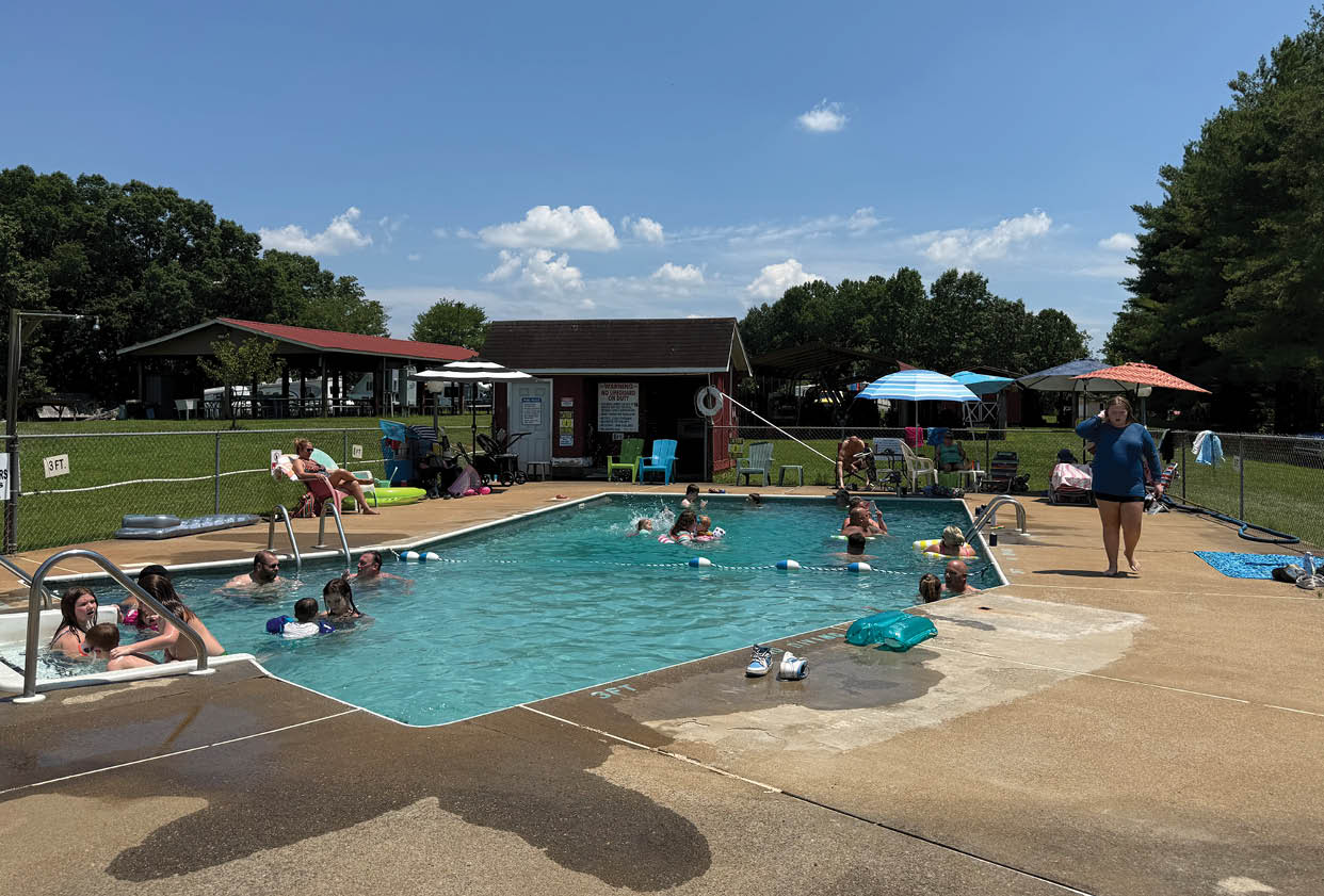 A group of people are enjoying a day at the pool. AI generated content
