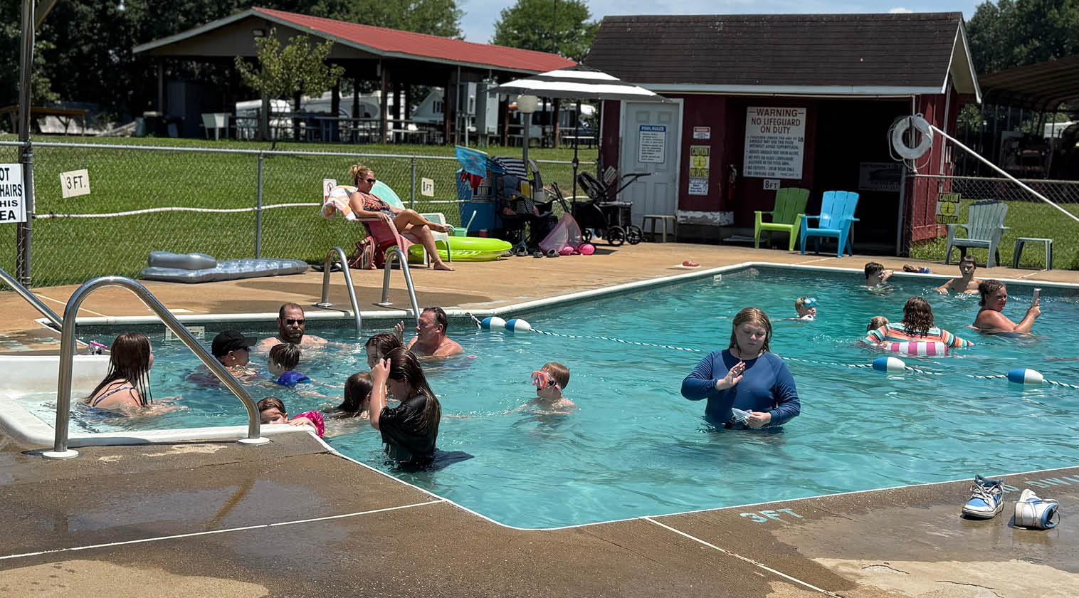 A group of people are swimming in a pool. AI generated content