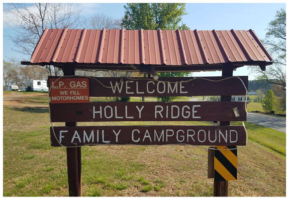 A sign welcoming visitors to Holly Ridge Family Campground. AI generated content