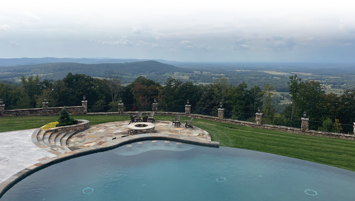 A large pool with a stone deck and a view of the mountains. AI generated content