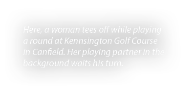 Here, a woman tees off while playing a round at Kennsington Golf Course in Canfield. Her playing partner in the backg...