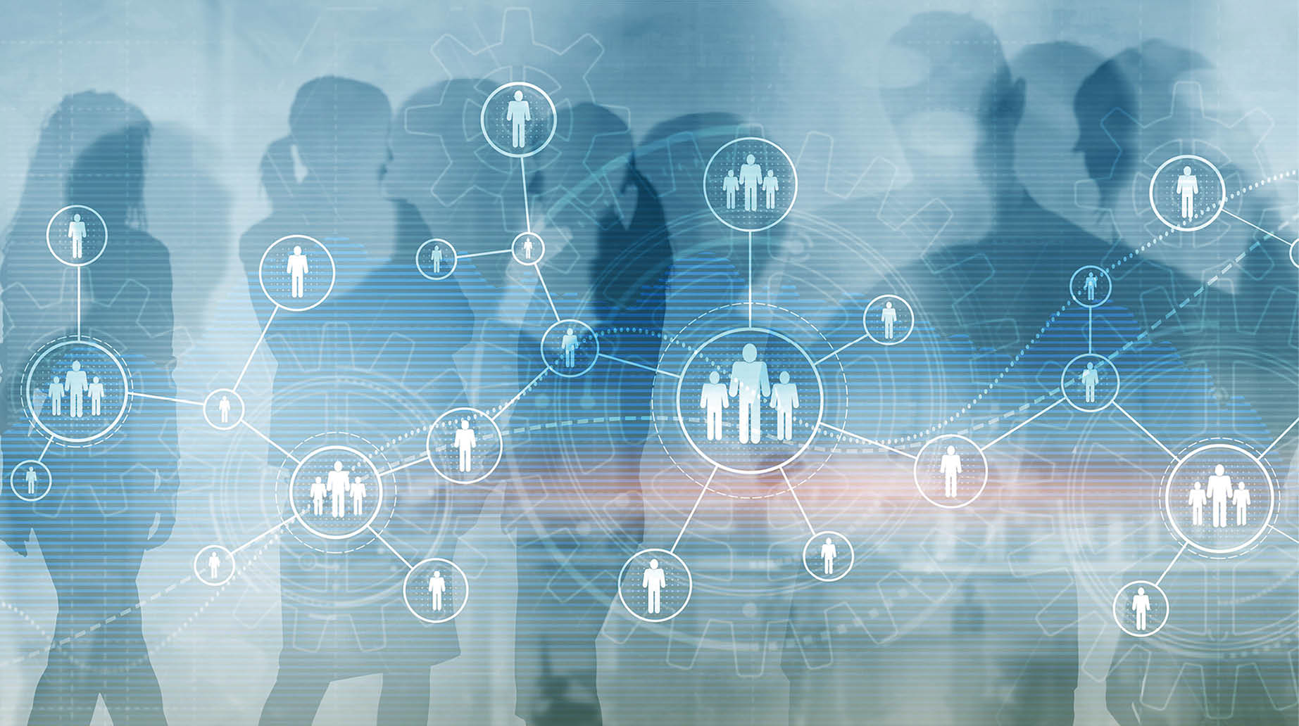A group of people are standing in front of a blue background. Description generated by AI