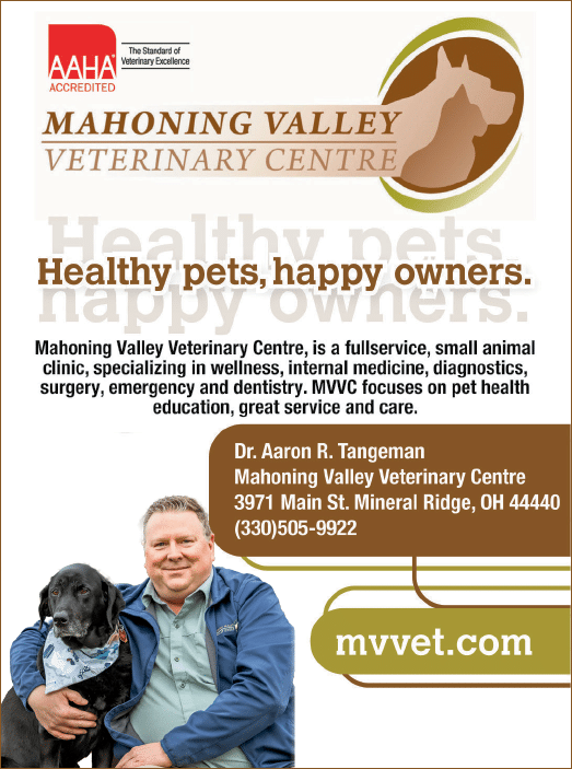 A white sign with black letters that says “Mahoning Valley Veterinary Centre". Description generated by AI