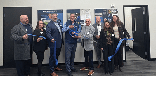 A group of people are holding blue ribbons. Description generated by AI